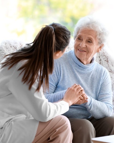 Nurse takes care of malnourished senior