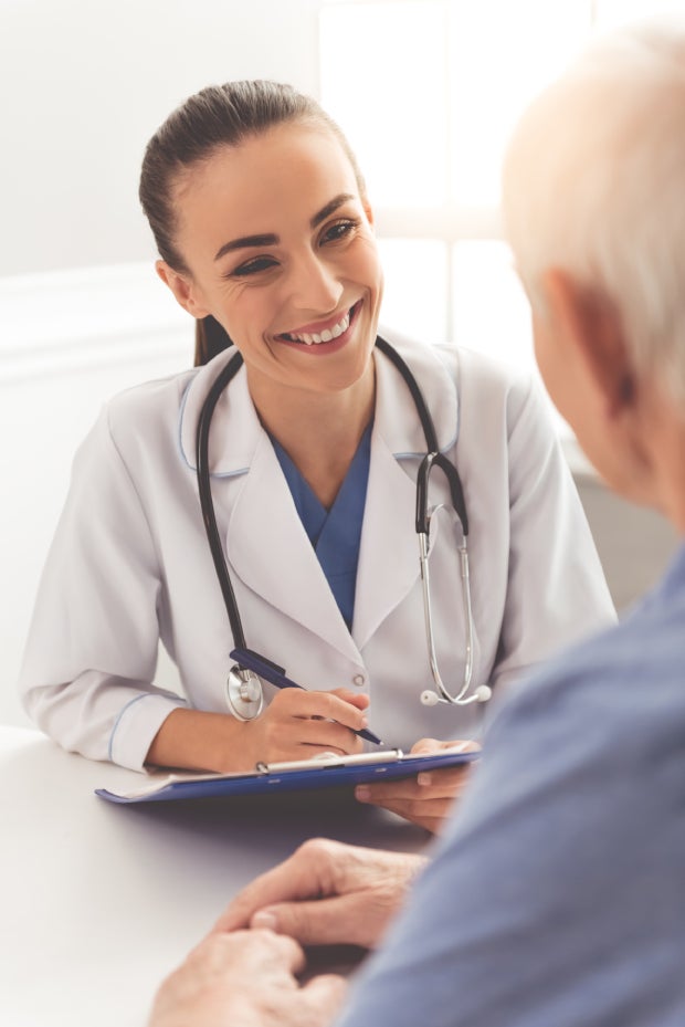 A caring doctor and a happy elderly patient