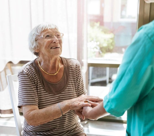 doctor helps old women