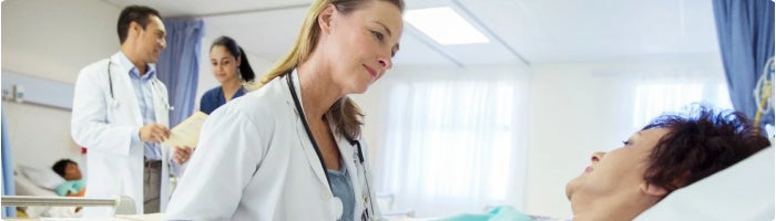 doctors speaking with patient