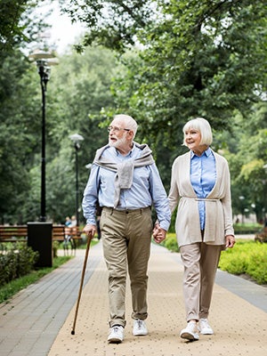 old couple walking in a park